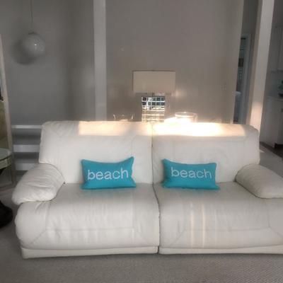 White leather motorized couch and chair.