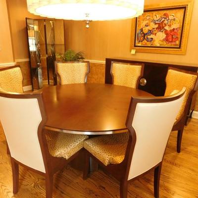 Circular dining table wit (6) chairs and buffet