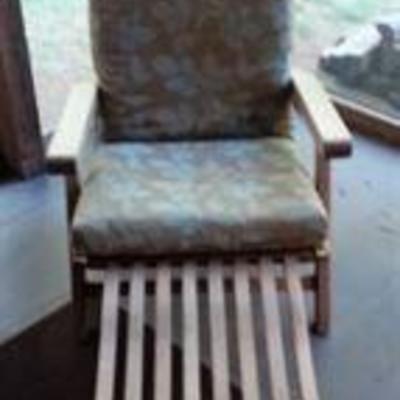 Slatted chair with pull out foot rest