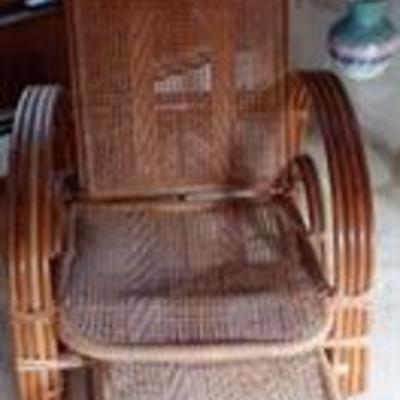 Wicker chair with slide out footrest