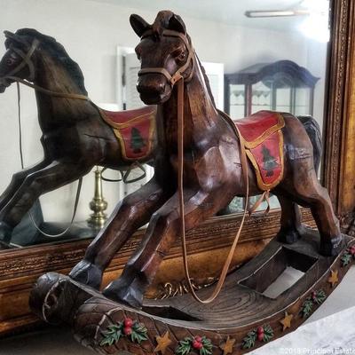 Carousel style wood rocking horse.  Gold gilded mirror