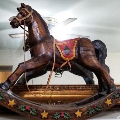 Carousel style wood rocking horse.  Gold gilded mirror