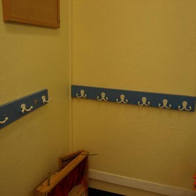 Multiple coat racks and hooks - different colors throughtout the school