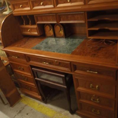 Burl Roll top desk, inside lights up, and has marble inset. FABULOUS DESK!