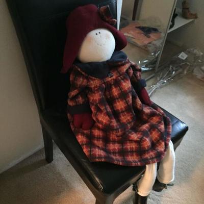Black Leather Chair with Doll.