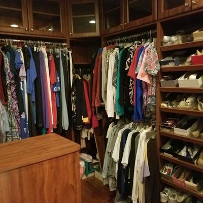 Several closets of womens clothing