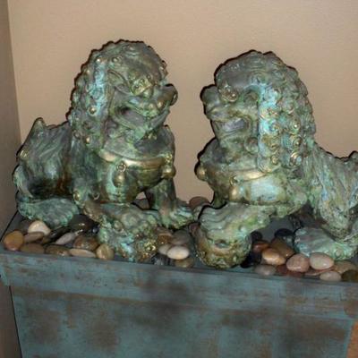 Foo Dogs with stand and decorative rocks.