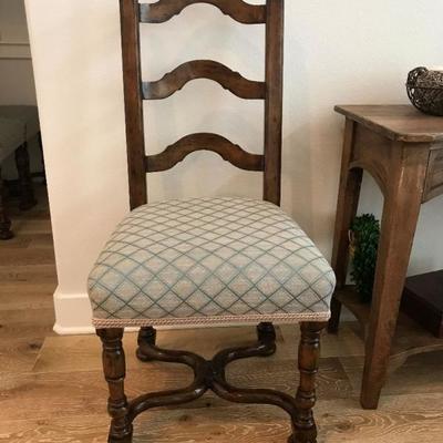 Custom made dining table and 4 chairs. Table is round with drop leaves to make it square. Originally purchased for $10,000. Estate sale...