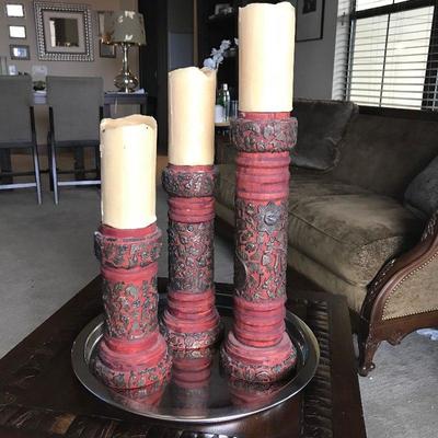 Red wood candlestick holders with tiny iron figurines. Hand made. Originally $275. Estate sale price: $120