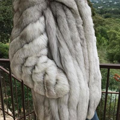 Blue fox natural fur coat. 3/4 length. Satin interior. Purchased for $4,500. Estate sale price: $1,150