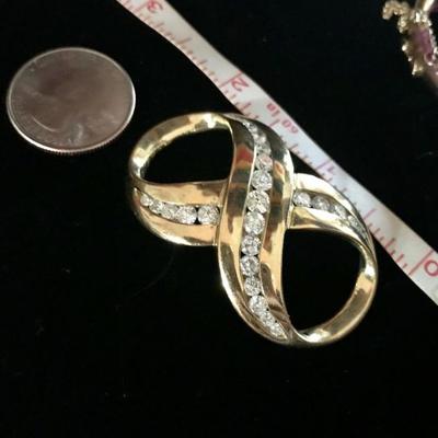 All jewelry reviewed and detailed by Jewelry Appraiser: SCARF HOLDER. 14K GOLD WITH 3.85 CT DIAMONDS. 25 DIAMONDS. $3,850