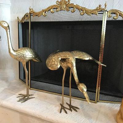 Large brass cranes. $65 each. Left 25 inches tall. Right 16 inches tall.  Fireplace screen. $65.