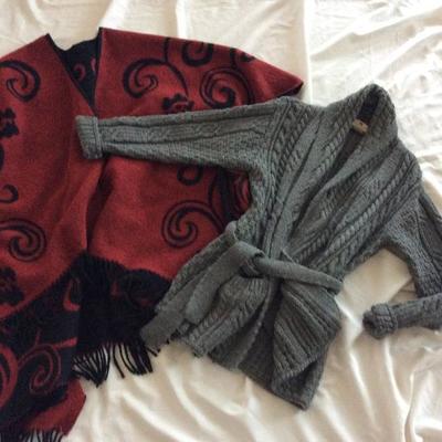 Red and black poncho @ $12. Gray sweater size L @ $18.