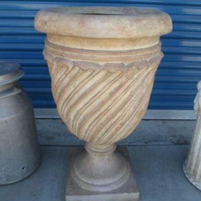 Outdoor yard pottery planter on a pedastal