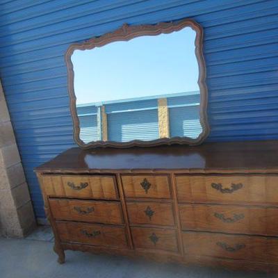 Triple dresser with attached mirror