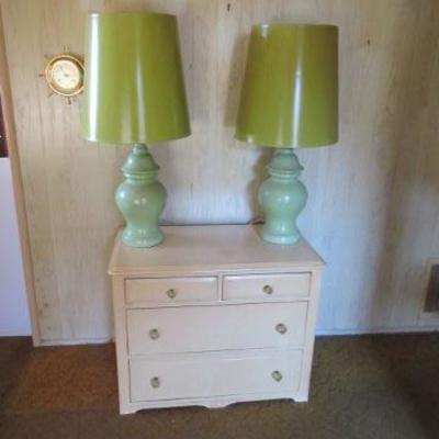 Vintage dresser painted white with some modern lamps