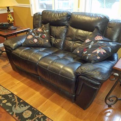 Leather love seat w/ recliners.