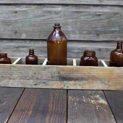 Wood box with vintage bottles