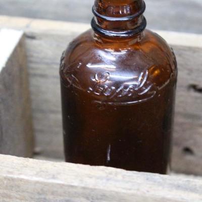 Wood box with vintage bottles