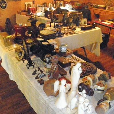 Table of antique and vintage collectibles