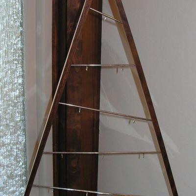 there are two Danish teak Christmas trees like this
