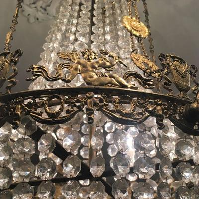 Gilt Metal and Crystal French Empire Chandelier Featuring Cherubs and Urns