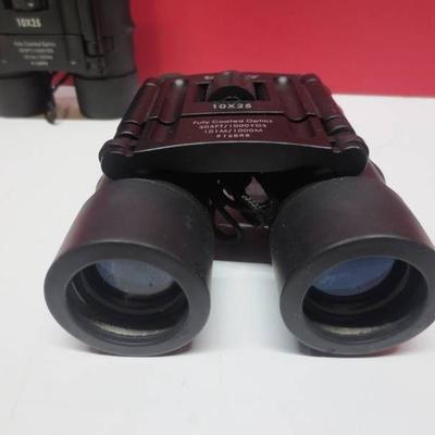 Lot of 2 Tasco 10x25 binoculars..
