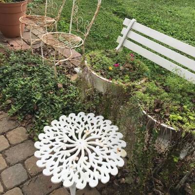 assorted outdoor furniture and garden art