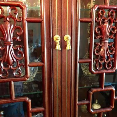 Imported from China in early 1980's Hand Carved Solid Rosewood Furniture With Gold Accent Hardware. Display cabinet with lighting
