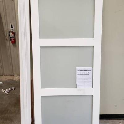 Wooden barn door with glass frosted panels