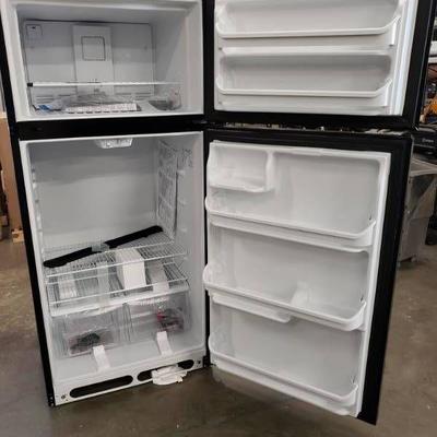 Frigidaire black refrigerator freezer.
