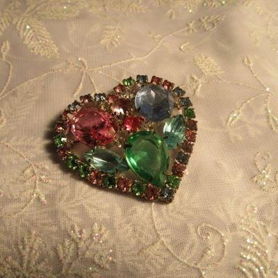 Colorful crystals or rhinestones in a heart shaped broche, vintage
