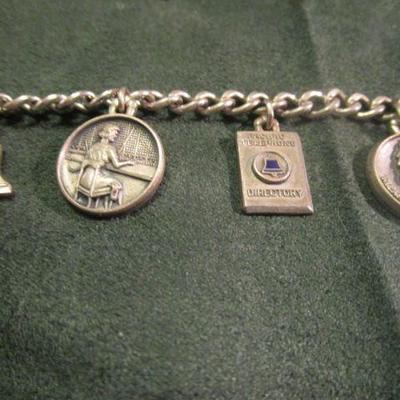 Vintage charm bracelet in silver tone of a 5 year anniversary from a vintage telephone company