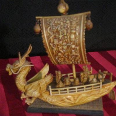 Heavy molded plastic of a mini ship with people and sails and other details, vintage toy