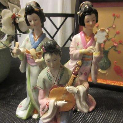 Girl Figurines playing instruments