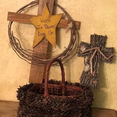Rustic crosses and pine cone basket