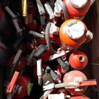 lot of used fire extinguishers