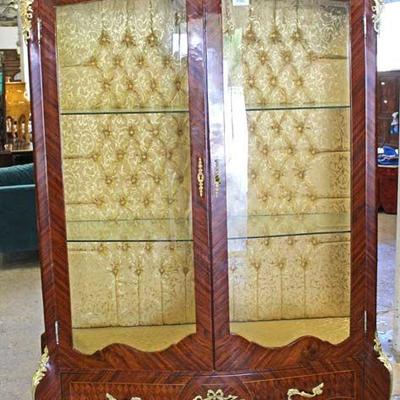 Selection of French Style Button Tufted Back Display Cabinets with Applied Bronze
Located Inside â€“ Auction Estimate $200-$400 each
