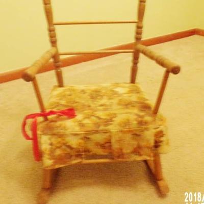 vintage children's rocker with red bow