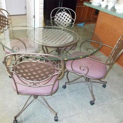 50" Glass table and 4 chairs$220

