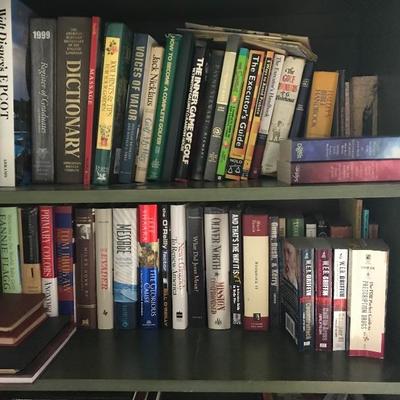 Lots of books and a couple bookcases 