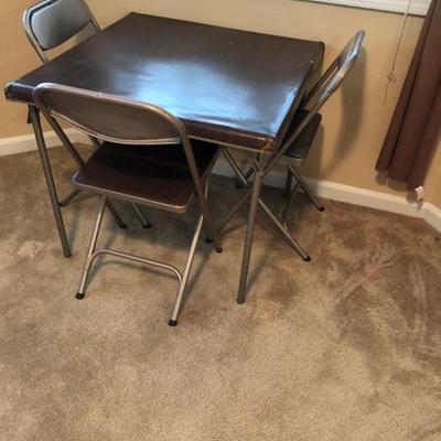 card table with three chairs