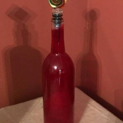 Glass Wine Bottle Stopper and red bottle