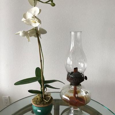 Artificial orchid with pot $15. Vintage kerosene lamp. $30