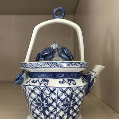 Marking: Xuande era 15c. (1426-1435). Chinese blue and white teapot. $250