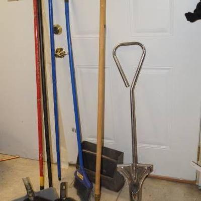 Lot of brooms and dustpans
