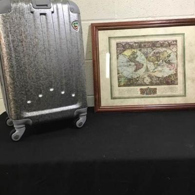 Luggage and Framed Picture