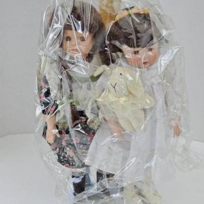 2 Porcelain Dolls w Plastic Protector
