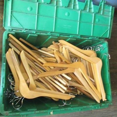 LARGE GREEN CRATE OF WOODEN HANGERS