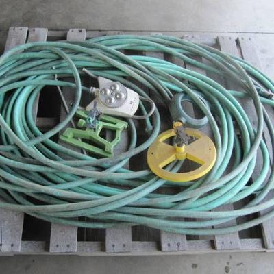 LOT OF A PALLET OF LAWN HOSES ANS SPRINKLERS USED ...